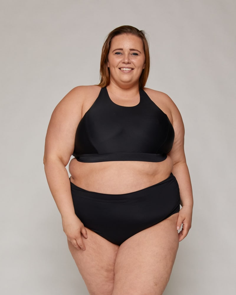 Front of a model wearing a size 18|20 Stella Ruched High-Waist Bottoms in Black by Wild Isles. | dia_product_style_image_id:295910